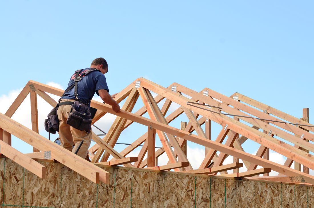 Defender Roofing Images - Roofers working on a roof replacement